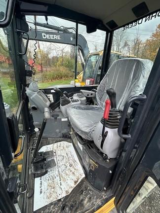 60G COMPACT EXCAVATOR - Cab w/ AC, Cntrl Pattern Select; Rubber Tracks; 24" Bucket; Aux Hydraulics, Coupler, Hydraulic Thumb; Angle Blade