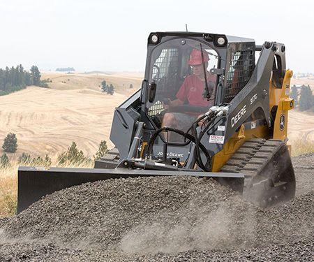 317G Compact Track Loader equipped with Dozer Blade
