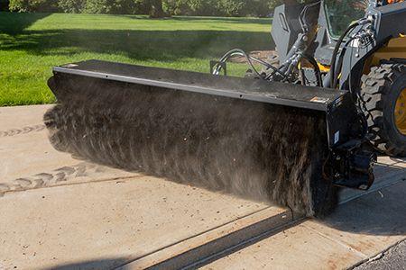BA96C Angled Broom featured on a 332G Skid Steer