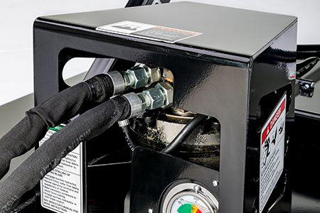 Motor cover protecting hydraulic hose connections