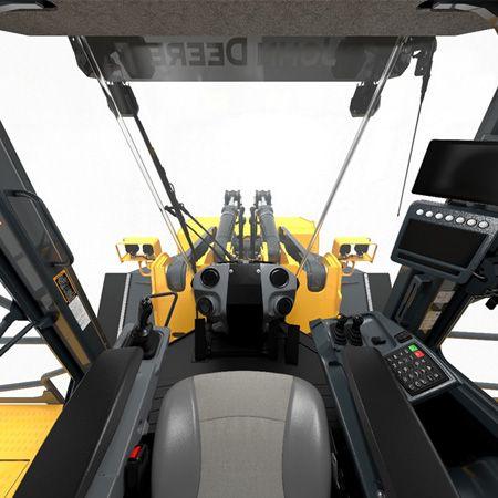 View of dual tilt cylinders and front floor to glass windows from operator’s seat