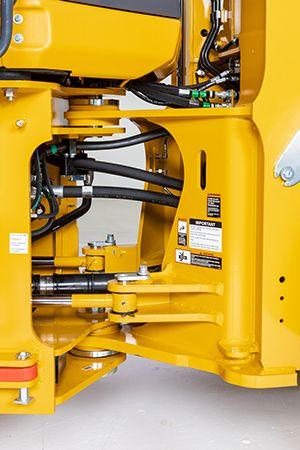 View of improved hydraulic routing at the loader articulation joint